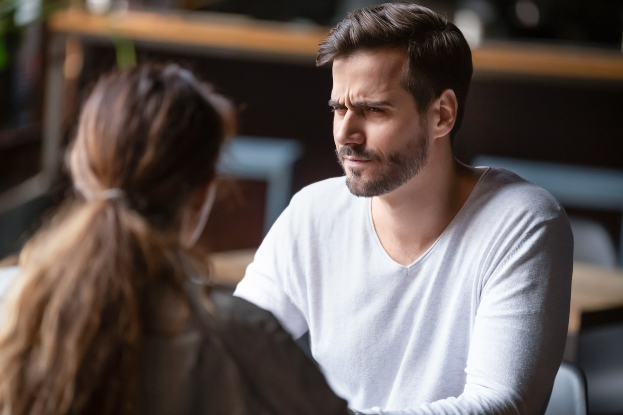 Doubting dissatisfied man looking at woman, bad first date