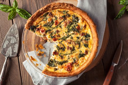 Homemade Cheesy Egg Quiche for Brunch with Spinach and Tomato