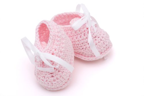 pair of pink booties for newborn