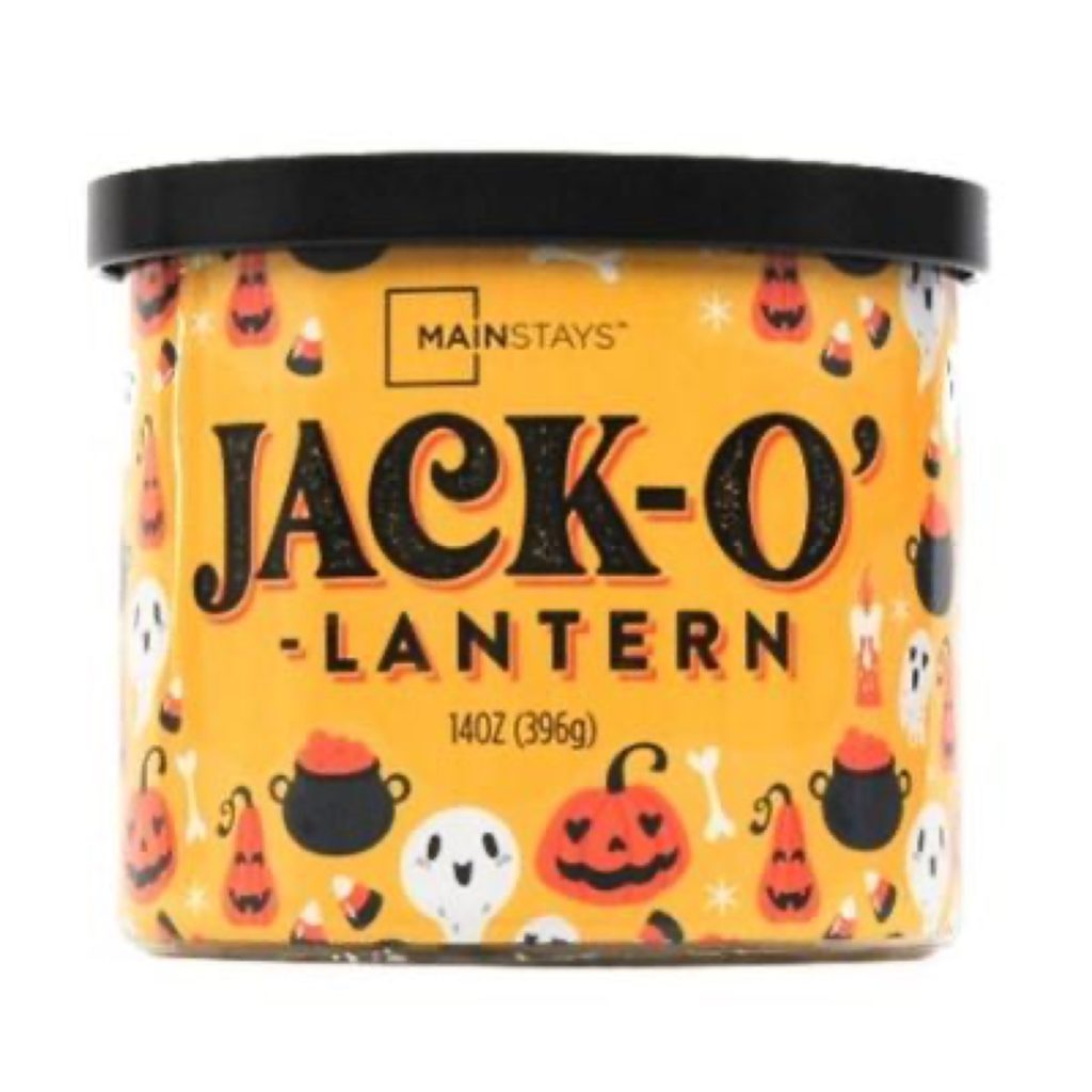 An orange Mainstays-brand Jack-o'-Lantern scented candle