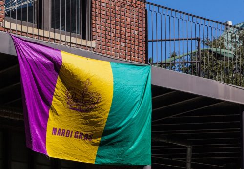 A balcony decorated with the Mardi Gras flag at the parade in Mobile, Alabama February 2016