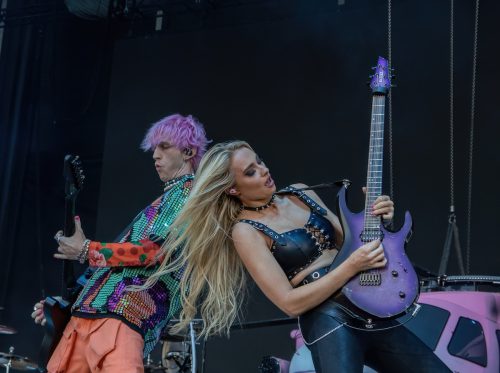 Machine Gun Kelly and Sophie Lloyd performing at Bonnaroo music festival in 2022