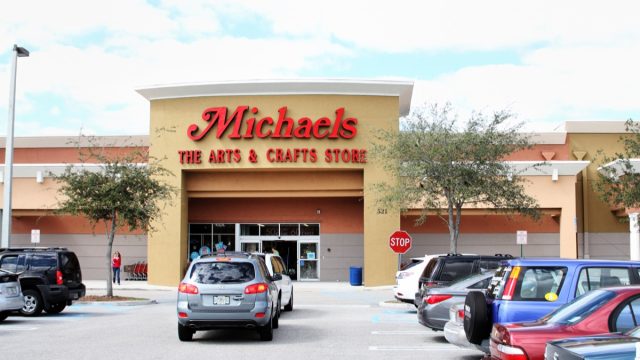 Michaels Arts and Crafts store in West Palm Beach, Florida. Michaels Stores sell a variety of arts and crafts items for hobbyists of all types. The parking lot is filled with cars on a bright sunny Florida day.