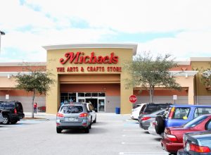 Michaels Arts and Crafts store in West Palm Beach, Florida. Michaels Stores sell a variety of arts and crafts items for hobbyists of all types. The parking lot is filled with cars on a bright sunny Florida day.