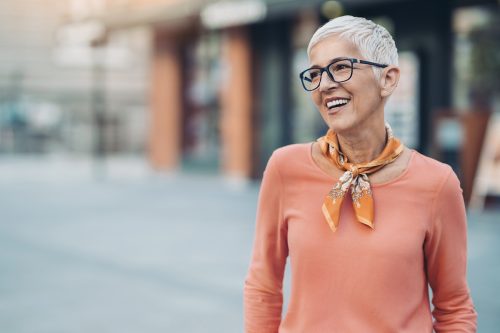 Smiling mature woman with short hair and eyeglasses