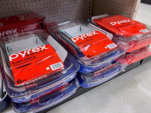 pyrex baking dishes stacked on a shelf in a store