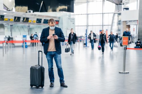 man wearing jeans at airport