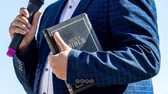 Pastor,With,A,Bible,In,His,Hand,During,A,Sermon.