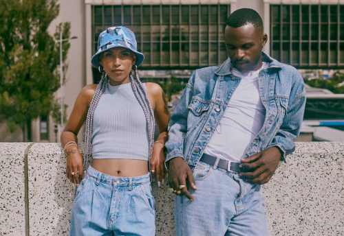 two black models posing in stylish jean outfits
