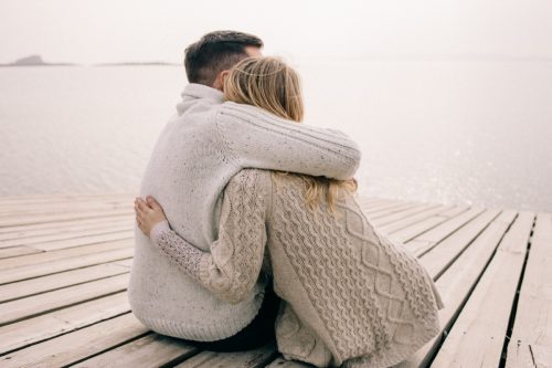 Couple Hugging on a Dock