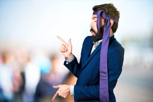 Man Dancing with Tie on His Head