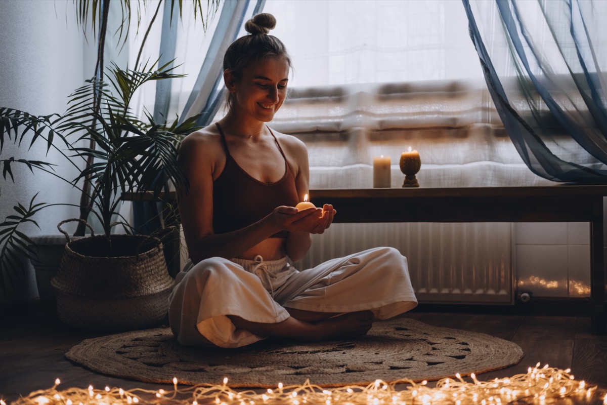 Person Meditating with Candles