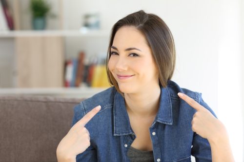 Woman Pointing at Herself