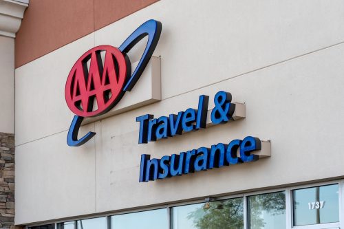 Close up of a sign on a AAA Travel & Insurance location