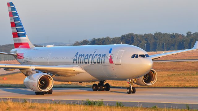 An American Airlines jet taxiing down a runway