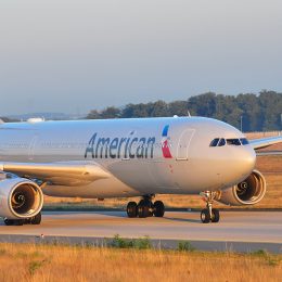 An American Airlines jet taxiing down a runway