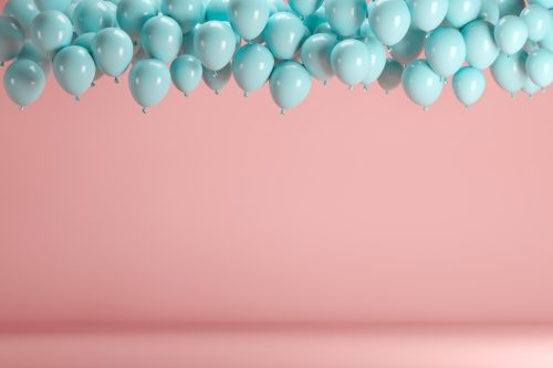 blue ballons in front of a pink background