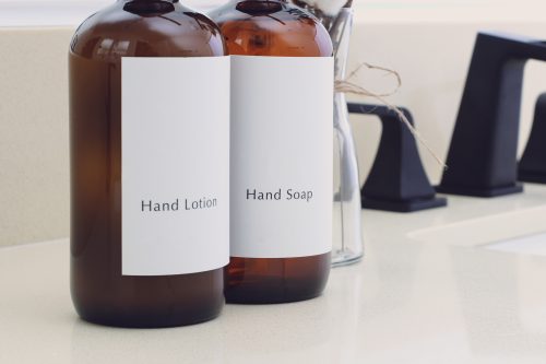 Matching bottles of hand soap and hand lotion in the bathroom