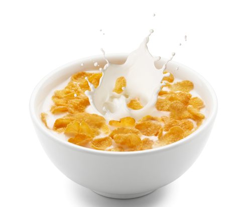 bowl of cornflakes with a splash of milk