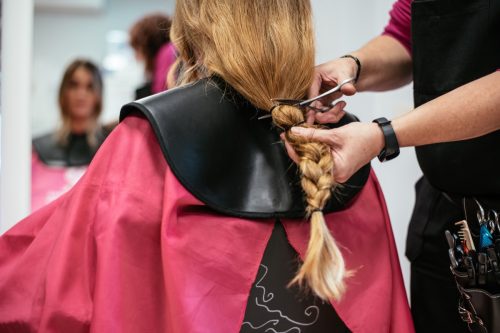Woman donating hair for cancer