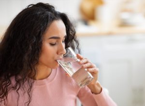 Woman Drinking Water From Glass
