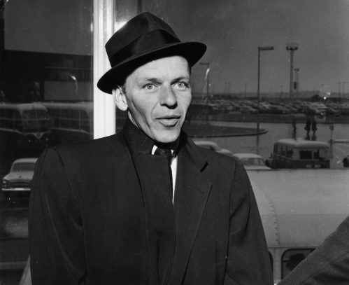 Frank Sinatra at the airport in London in 1956