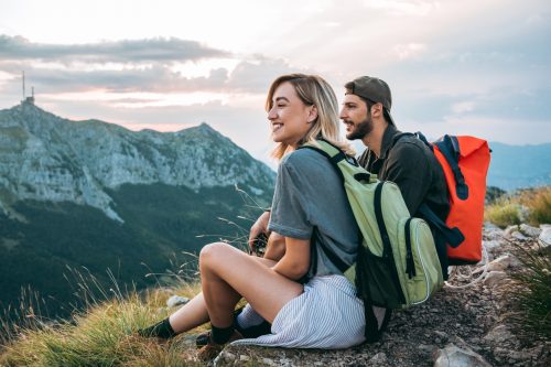 young couple of hikers enjoying nature