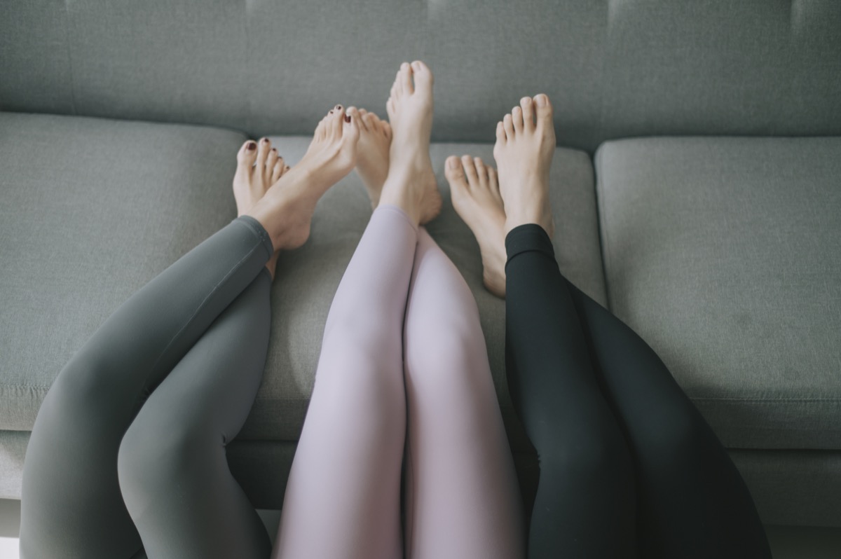 women wearing leggings with feet up