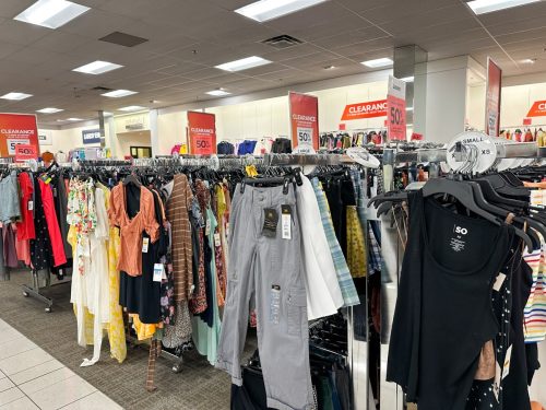 Huge clearance section of women's clothing at a Kohls department store. Excess inventory concept