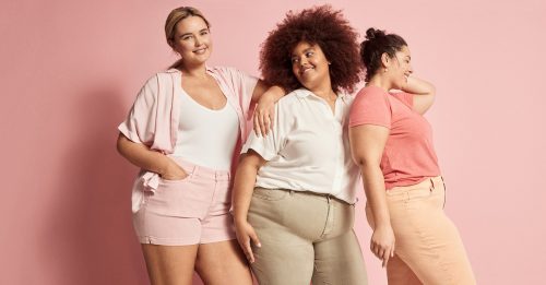 Three models wearing Lane Bryant clothing in pink and neutral hues