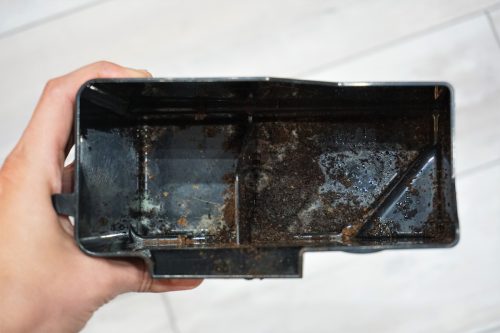 Compartment of a coffee maker that's moldy.