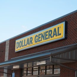 The front store sign of a Dollar General in the morning light.