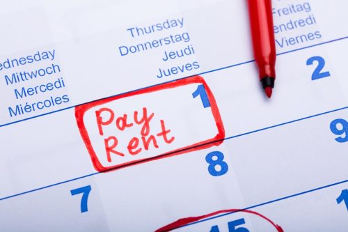 Pay Rent Note Made Using Red Marker In Paper Calendar