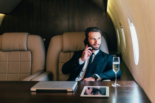 Rich businessman flying on his private jet