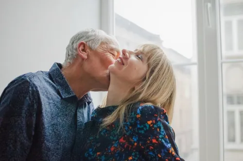 mature man and woman kissing