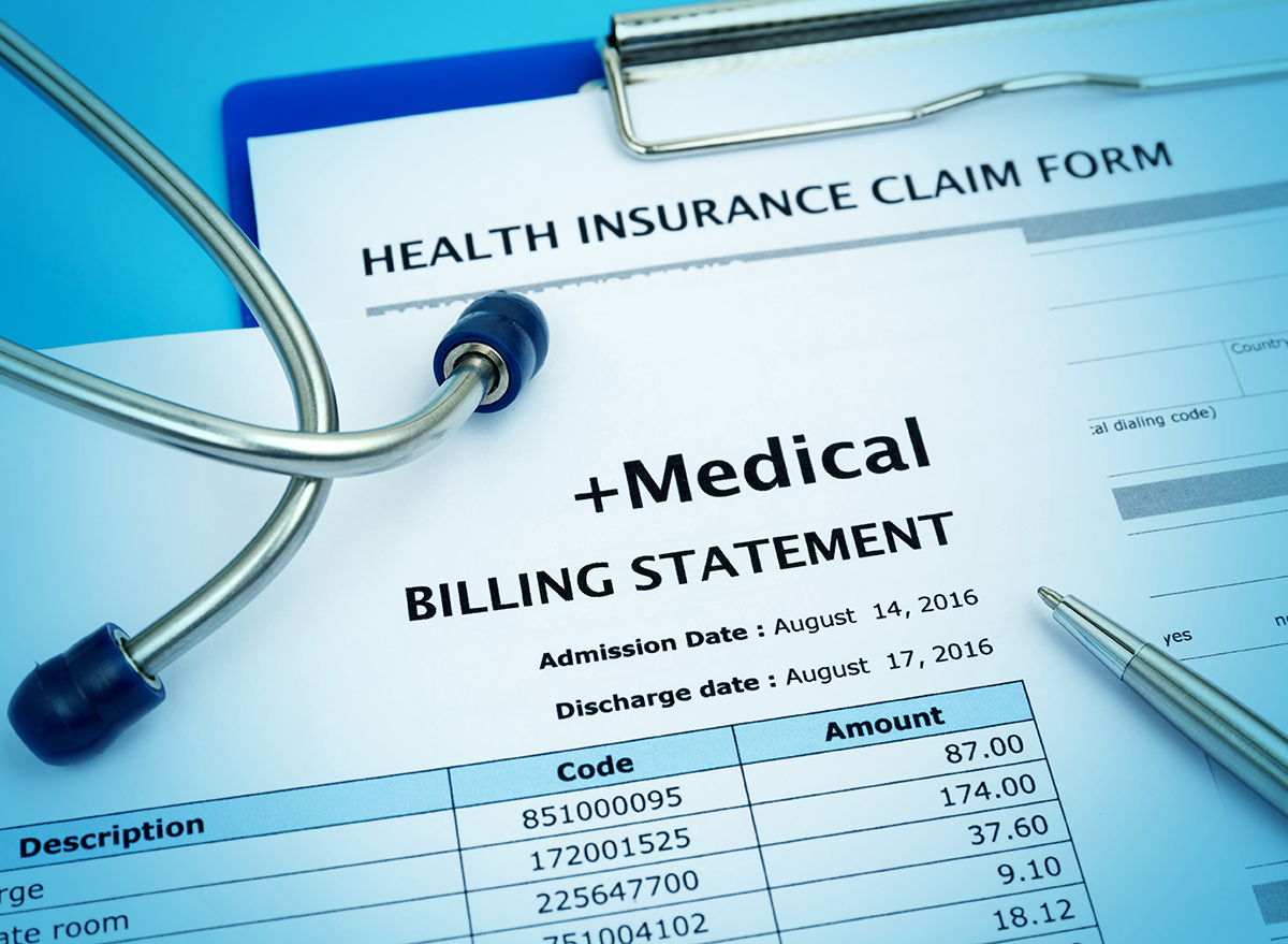 Close up of a medical billing statement and health insurance claim form 