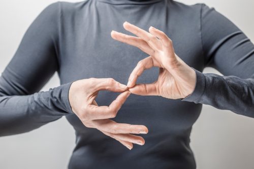woman communicating through sign language