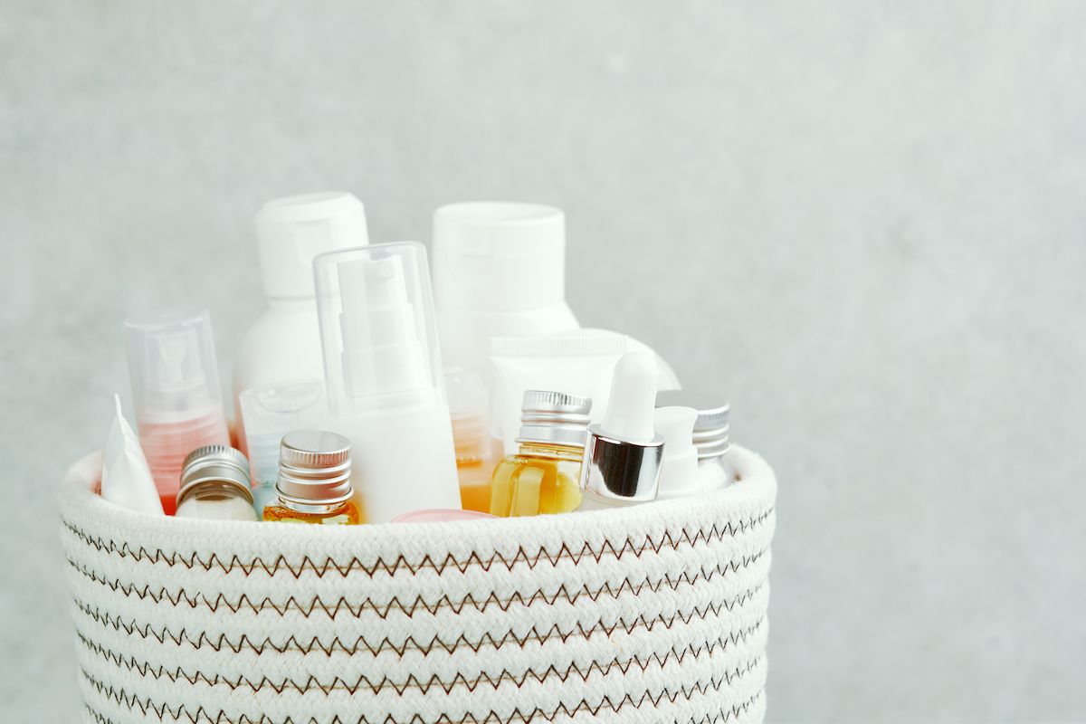 A woven white basket filled with toiletries