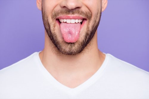 man sticking out his tongue