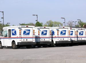 A fleet of United States Postal Service (USPS) mail delivery vehicles await deployment in Franklin Park, Illinois.