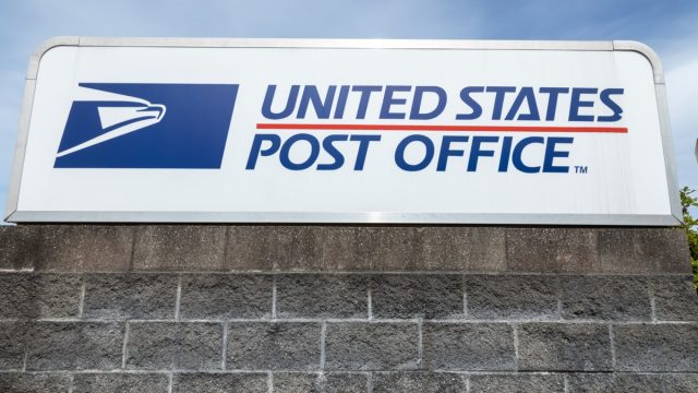 "United States Post Office" sign at the USPS South Hill branch, with space for text on bottom