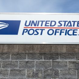 "United States Post Office" sign at the USPS South Hill branch, with space for text on bottom