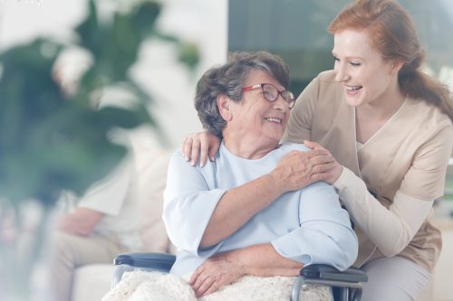 woman embracing patient at a nursing home