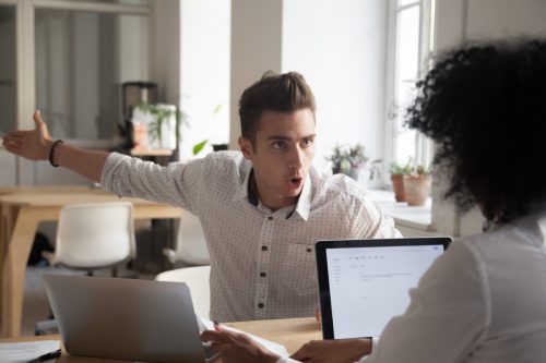 Male Coworker Yelling At Colleague