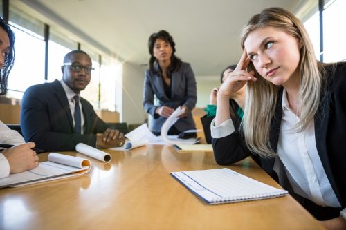 Woman Not Paying Attention in Meeting