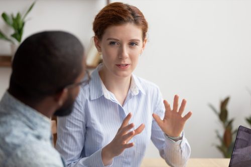 Woman Offering Advice to Her Coworker