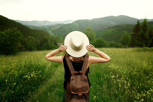 Woman traveler in Middle of Field