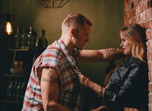 man and woman flirting at a bar