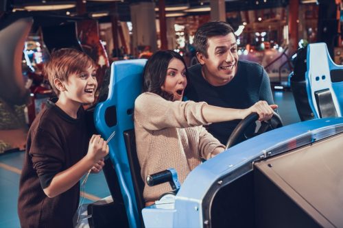 family celebrating father's day at an arcade