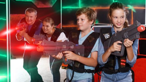 family playing laser tag together